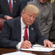 President Donald Trump signs a bipartisan bill to stop the flow of opioids into the United States in the Oval Office of the White House on Jan. 10, 2018, in Washington, D.C.